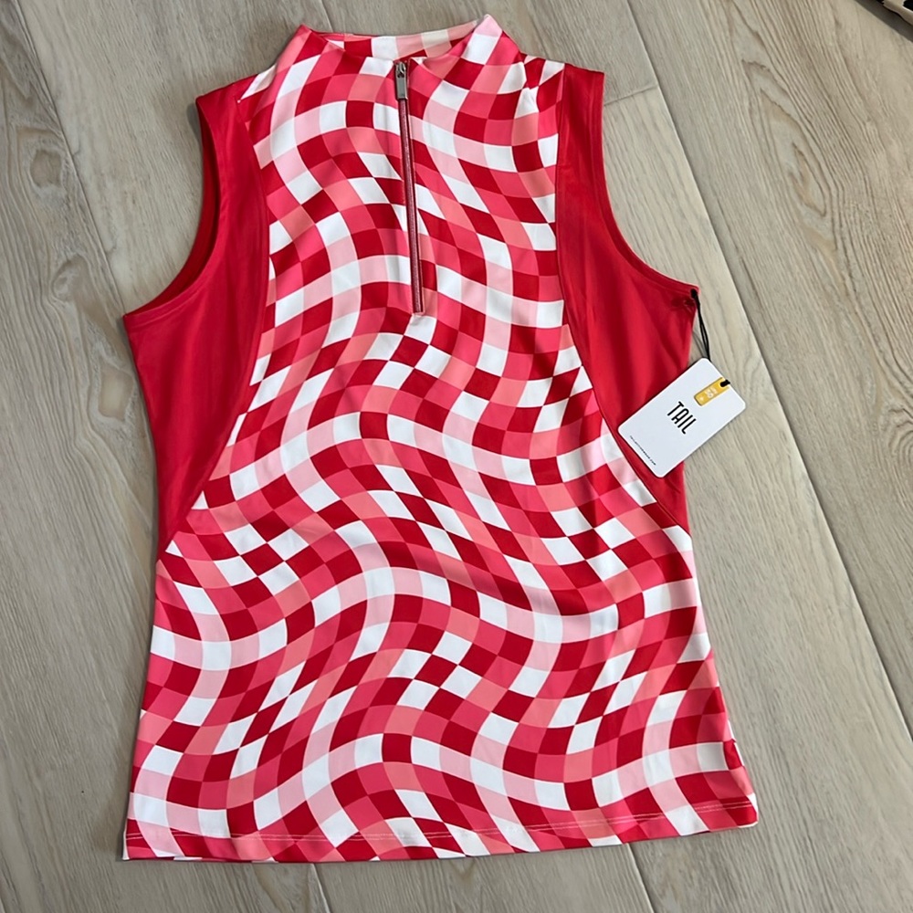 Brand new with tags. Ladies sleeveless golf top. Tail brand